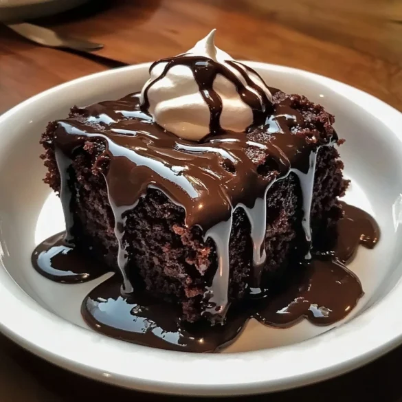 A plate of Hot Fudge Chocolate Pudding Cake with a scoop of vanilla ice cream.